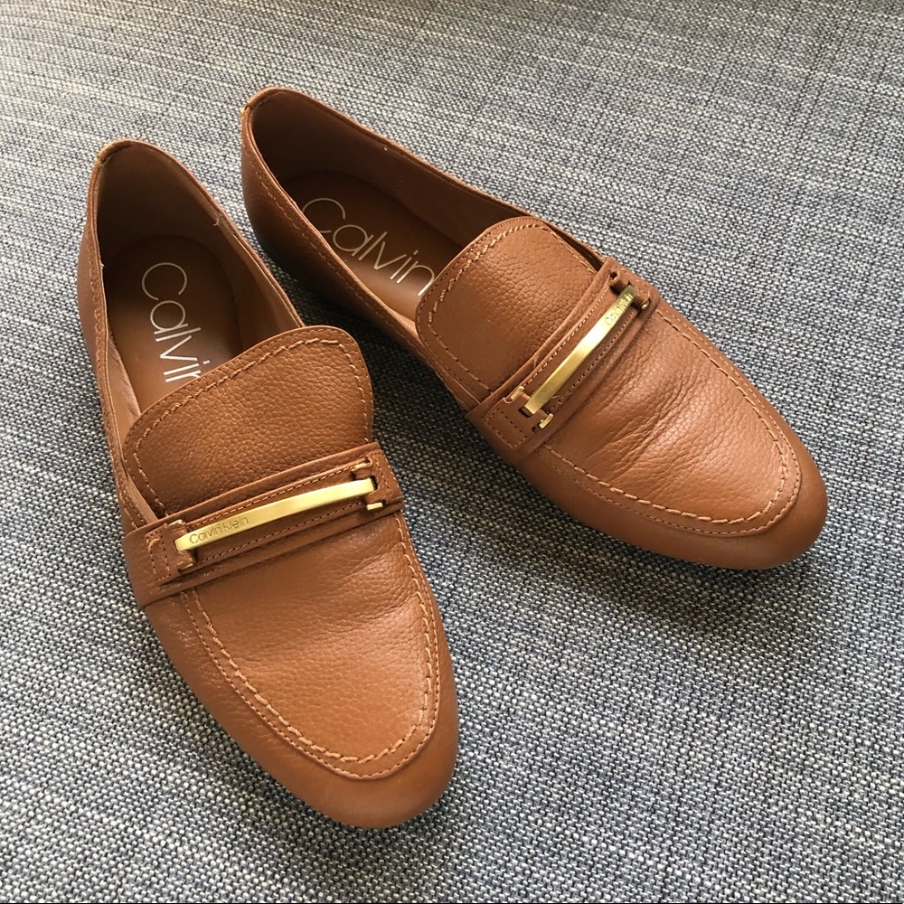 Calvin Klein cognac leather loafers. 8